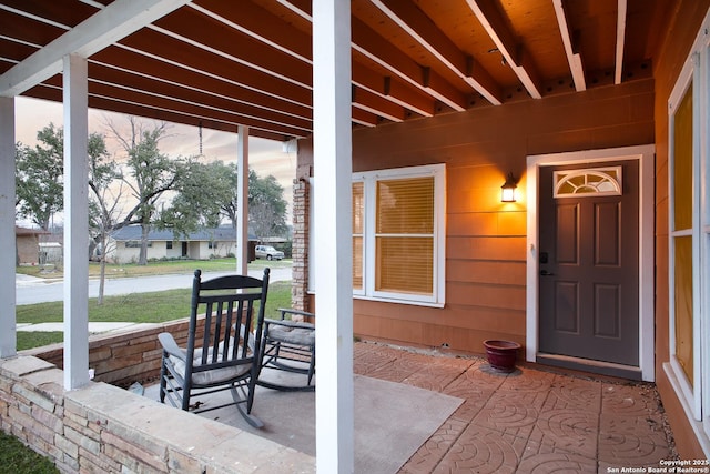 view of patio terrace at dusk