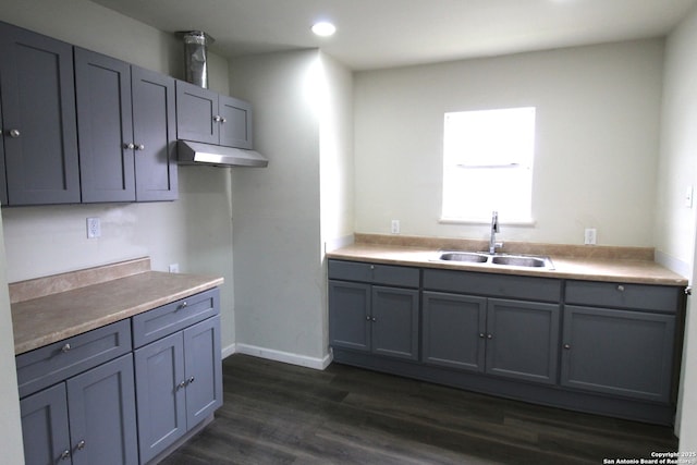 kitchen featuring gray cabinets, sink, and dark hardwood / wood-style floors