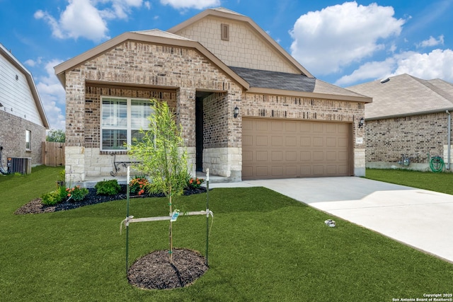 french country inspired facade featuring brick siding, central air condition unit, concrete driveway, a front yard, and a garage