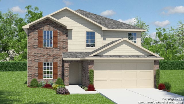 view of front of house featuring a front lawn and a garage