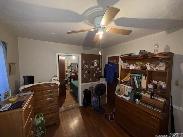 bedroom featuring ceiling fan and dark hardwood / wood-style flooring