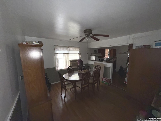 dining area featuring dark hardwood / wood-style floors and ceiling fan