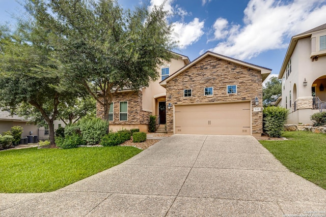 view of front of property with a garage and a front yard