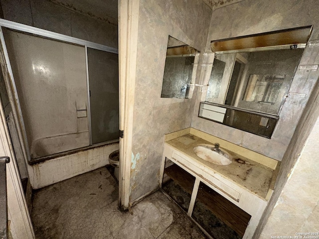 bathroom with vanity and enclosed tub / shower combo