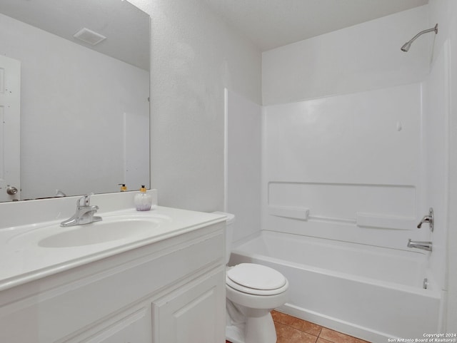 full bathroom with vanity, toilet, tile patterned floors, and bathtub / shower combination