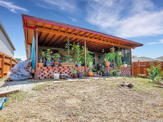 exterior space with ceiling fan