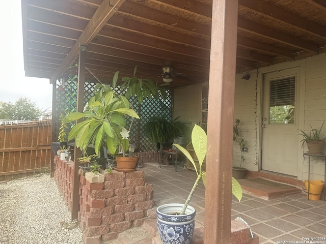 view of patio featuring ceiling fan