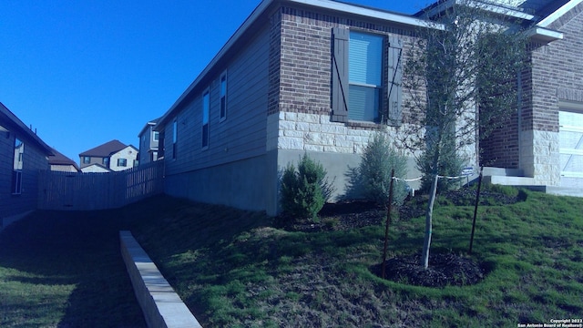 view of property exterior featuring a yard