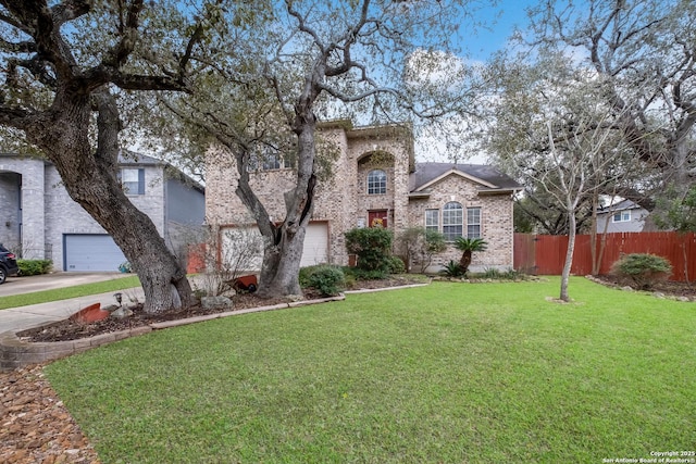 view of front of property featuring a front lawn and a garage