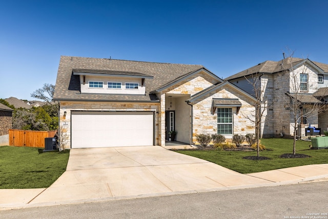 view of front facade featuring concrete driveway, central AC, fence, stone siding, and a front lawn