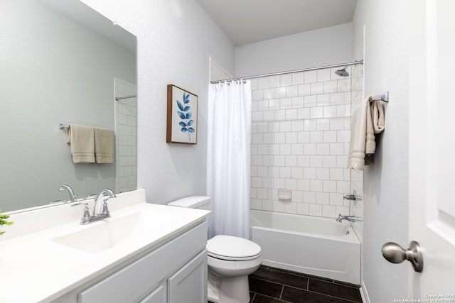 full bath with shower / tub combo, wood finish floors, vanity, and toilet