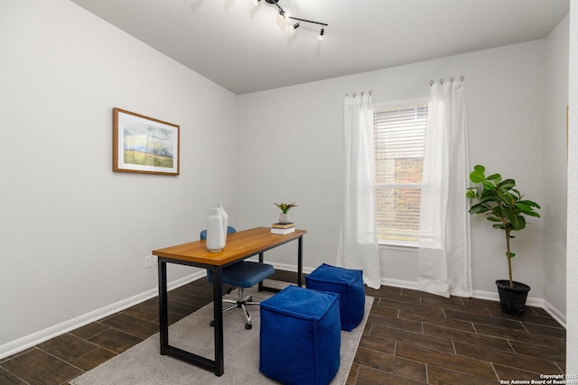 office area featuring baseboards, rail lighting, and wood tiled floor