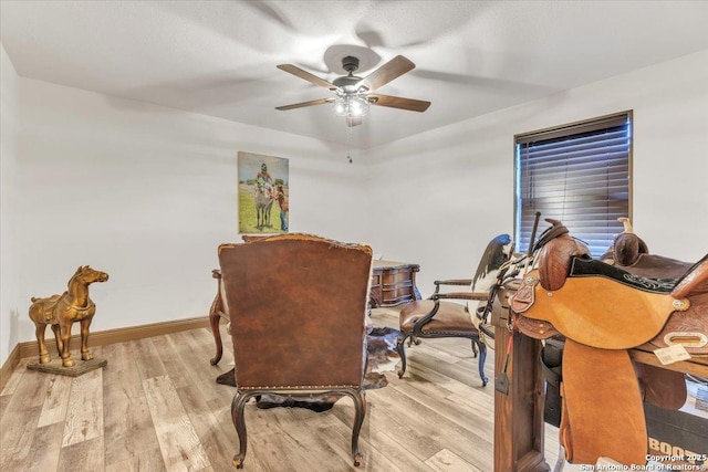 interior space with light wood-type flooring and ceiling fan