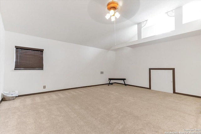 bonus room with light carpet, high vaulted ceiling, and ceiling fan