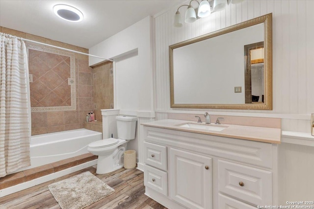 full bathroom featuring toilet, vanity, shower / bathtub combination with curtain, and hardwood / wood-style floors