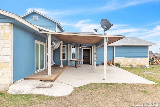 rear view of property featuring a patio area