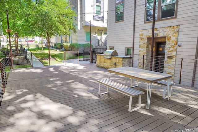 wooden deck featuring grilling area and area for grilling