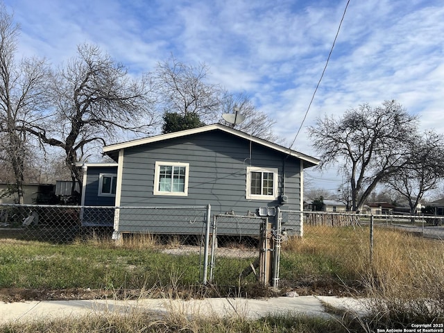 view of side of home with fence