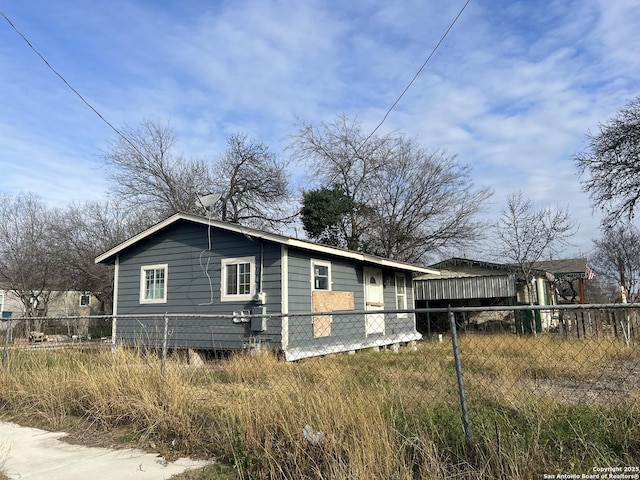 view of property exterior featuring fence