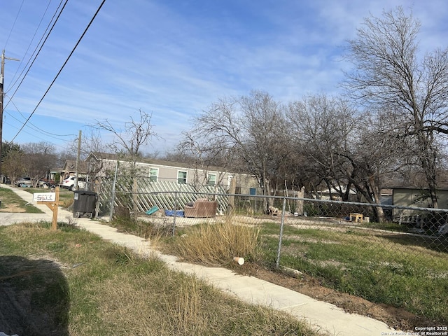 view of front of house featuring fence