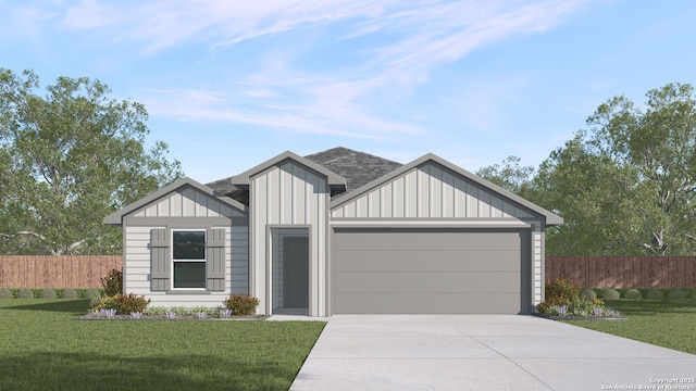 view of front of property with a garage and a front yard