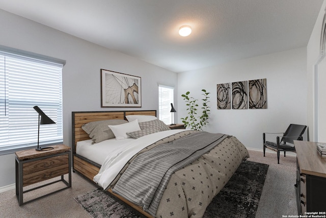 carpeted bedroom featuring baseboards