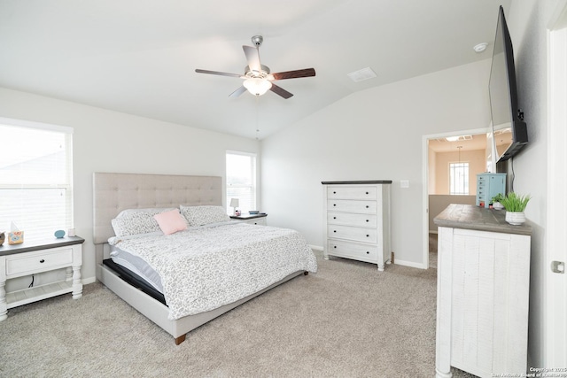 carpeted bedroom featuring vaulted ceiling and ceiling fan