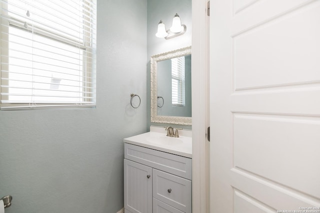 bathroom featuring plenty of natural light and vanity