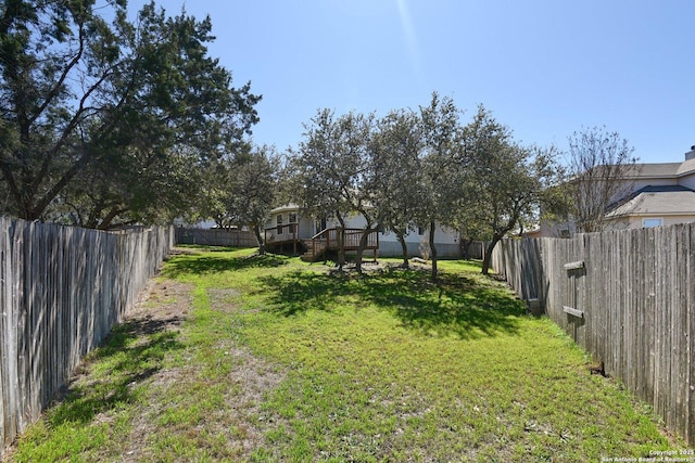 view of yard with a fenced backyard