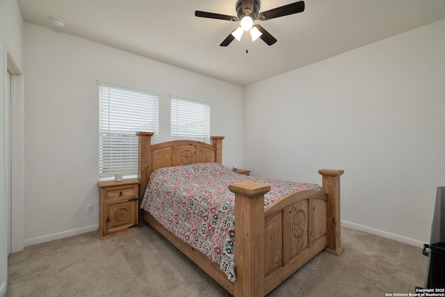 bedroom featuring ceiling fan and light colored carpet