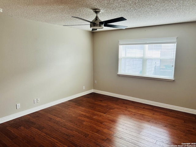 empty room featuring ceiling fan, wood-type flooring, and a textured ceiling