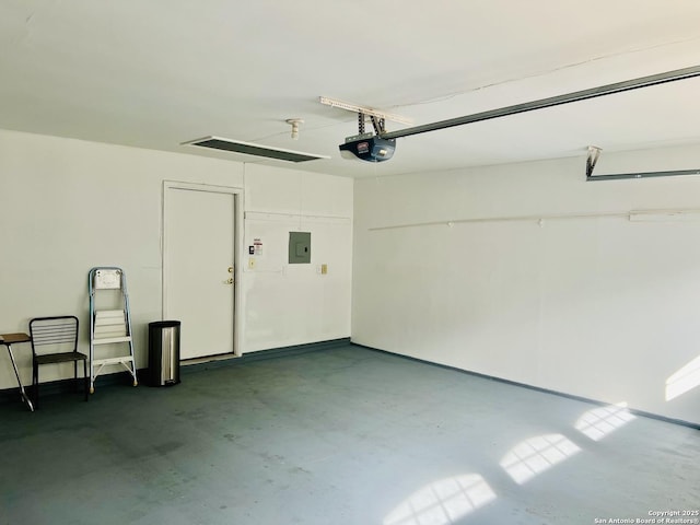 garage featuring electric panel and a garage door opener