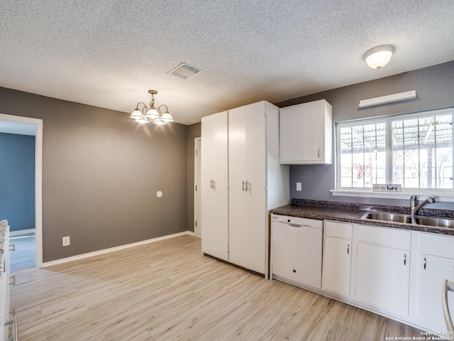 kitchen featuring light hardwood / wood-style flooring, a notable chandelier, dishwasher, sink, and white cabinetry