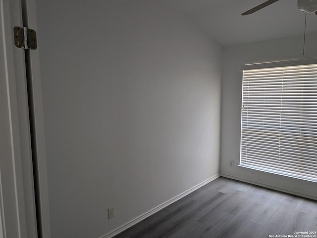 spare room with hardwood / wood-style flooring and ceiling fan