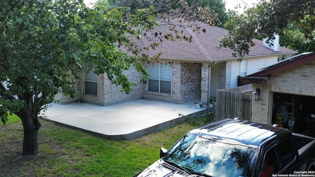 exterior space with a yard and a patio area