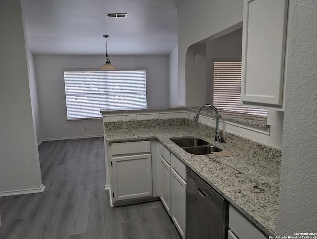 kitchen with white cabinetry, sink, pendant lighting, and dishwasher