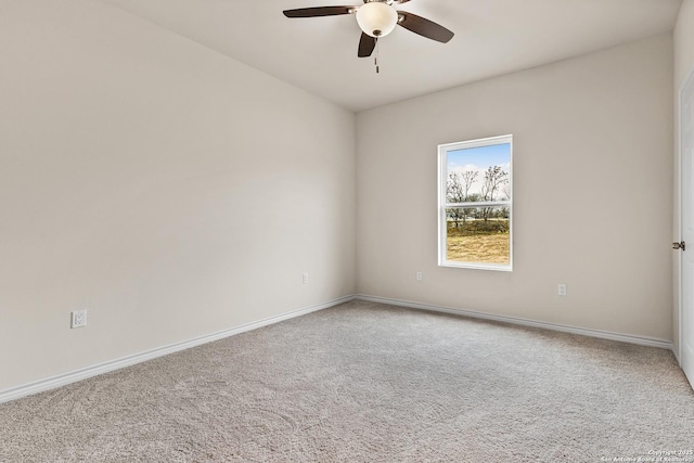 unfurnished room featuring baseboards, a ceiling fan, and carpet flooring