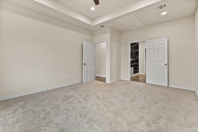 unfurnished bedroom with recessed lighting, visible vents, baseboards, and light colored carpet