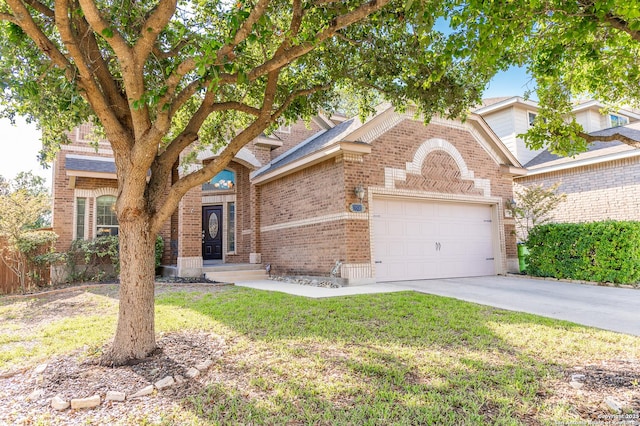 view of front of house with a garage and a front lawn