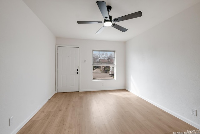 unfurnished room with ceiling fan and light hardwood / wood-style floors