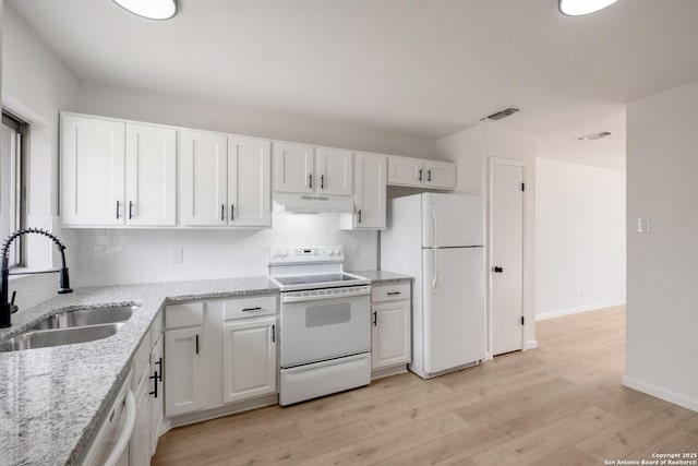 kitchen with white cabinetry, white appliances, and sink