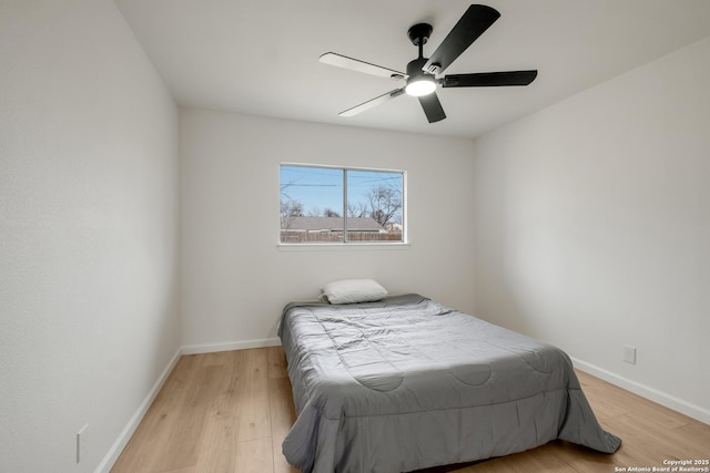 bedroom with ceiling fan and light wood-type flooring