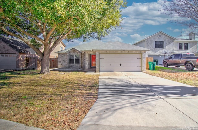 view of front of house with a front yard and a garage