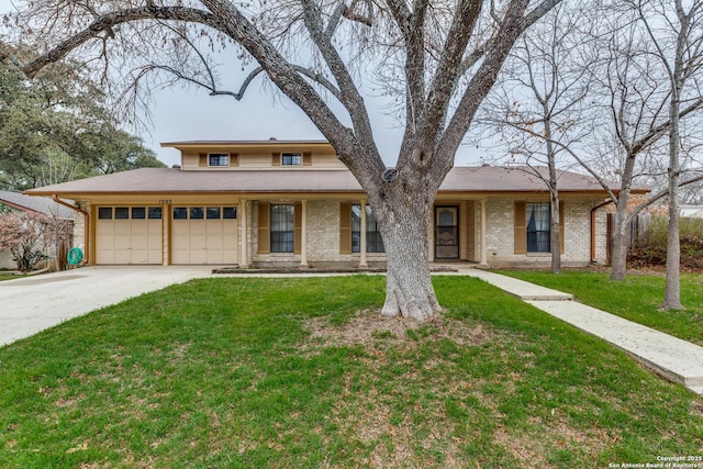 view of front of house with a garage and a front yard