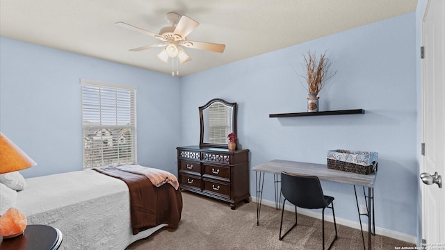 bedroom featuring ceiling fan, baseboards, and light carpet