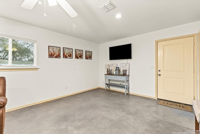 interior space featuring concrete floors and ceiling fan