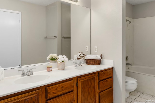 full bathroom featuring double vanity, shower / tub combination, a sink, and tile patterned floors