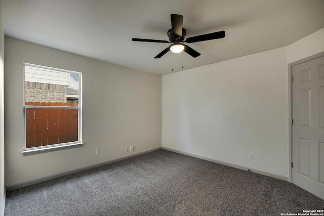 unfurnished room featuring baseboards, a ceiling fan, and carpet