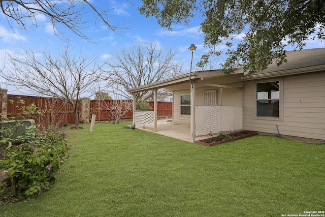 view of yard with a fenced backyard and a patio area