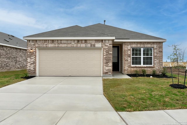 view of front facade with an attached garage, a front lawn, and brick siding